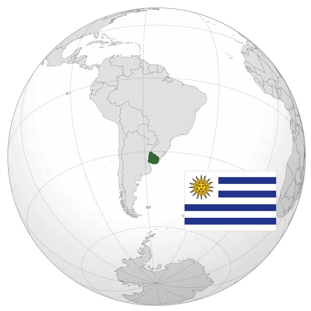 Globo terráqueo con Uruguay destacado y su bandera